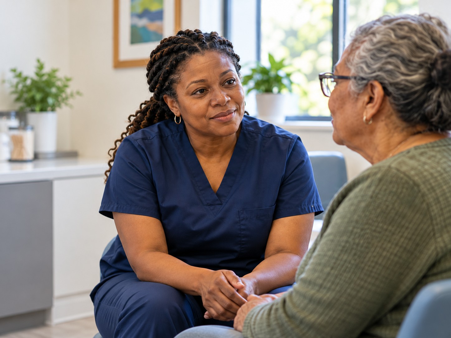 Illustrative clinician listening to an older patient in a community health center